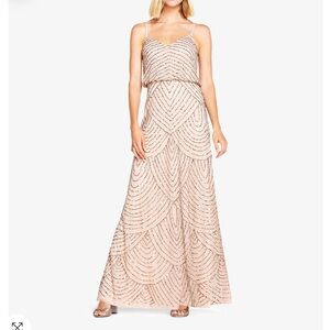 Worn as a bridesmaid dress. 3 strands of beads unraveled which are pictured